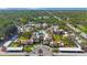 Scenic aerial view of a condo complex with a pool and lush green surroundings at 2205 Belleair Rd # A24, Clearwater, FL 33764