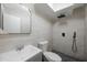 Updated bathroom features modern tile and rainfall shower head at 2205 Belleair Rd # A24, Clearwater, FL 33764