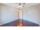 Bedroom with ceiling fan, closet and rich wood floors at 2205 Belleair Rd # A24, Clearwater, FL 33764