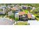 Exterior view of a condo building with palm trees and well-maintained landscaping at 2205 Belleair Rd # A24, Clearwater, FL 33764