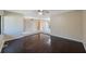 Open living room with hardwood floors transitioning to tile, offering flexible layout and style at 2205 Belleair Rd # A24, Clearwater, FL 33764