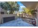 Open patio area surrounded by tropical landscaping at 2205 Belleair Rd # A24, Clearwater, FL 33764