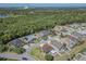Aerial view of a residential neighborhood and surrounding green space at 2310 Wood Pointe Dr, Holiday, FL 34691