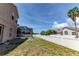 A screened lanai and a white vinyl fence enclose the backyard at 2310 Wood Pointe Dr, Holiday, FL 34691