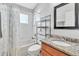 Bathroom featuring granite countertop vanity and shower with curtain at 2310 Wood Pointe Dr, Holiday, FL 34691