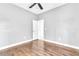 Bedroom featuring wood floors and an open doorway at 2310 Wood Pointe Dr, Holiday, FL 34691