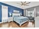 Spacious main bedroom suite with hardwood floors and large window at 2310 Wood Pointe Dr, Holiday, FL 34691
