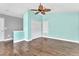 Bedroom with hardwood floors, closet, and ample lighting near the loft space at 2310 Wood Pointe Dr, Holiday, FL 34691