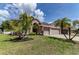 Beautiful home showcasing manicured landscaping and a spacious driveway at 2310 Wood Pointe Dr, Holiday, FL 34691