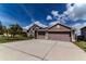 Lovely home with a spacious driveway and a well-maintained lawn at 2310 Wood Pointe Dr, Holiday, FL 34691