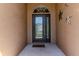 Elegant front entryway featuring a decorative glass door and stylish sidelights at 2310 Wood Pointe Dr, Holiday, FL 34691