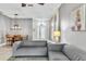 Inviting living area with tile flooring, stylish furniture, and abundant natural light at 2310 Wood Pointe Dr, Holiday, FL 34691
