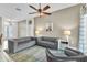 Bright and airy living room featuring modern decor, tile floors and lots of space at 2310 Wood Pointe Dr, Holiday, FL 34691