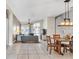 Open-concept living and dining area filled with natural light and neutral tones at 2310 Wood Pointe Dr, Holiday, FL 34691