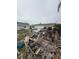 Heavily damaged single-story home surrounded by debris at 249 144Th Ave, Madeira Beach, FL 33708