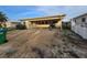 Charming single-story home featuring a covered carport and ample parking space for outdoor activities at 249 144Th Ave, Madeira Beach, FL 33708