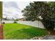 Spacious backyard featuring a well-maintained lawn, privacy fence, and some perimeter landscaping at 30623 Bittsbury Ct, Wesley Chapel, FL 33543