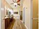 Bright bathroom with a soaking tub, separate shower, dual sinks, and wood-look flooring, exuding luxury at 30623 Bittsbury Ct, Wesley Chapel, FL 33543