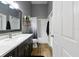 Bathroom with a large vanity and tub/shower combo, offering both style and functionality at 30623 Bittsbury Ct, Wesley Chapel, FL 33543