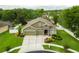 Beautiful single-story home with a well-manicured lawn and a two car garage, perfect for any Gathering at 30623 Bittsbury Ct, Wesley Chapel, FL 33543