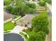 Inviting two-story home featuring a manicured lawn, mature landscaping, and a two-car garage at 30623 Bittsbury Ct, Wesley Chapel, FL 33543
