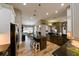 Spacious kitchen featuring a center island with seating and wood-look tile floors at 30623 Bittsbury Ct, Wesley Chapel, FL 33543