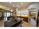 Open kitchen with pendant lighting, granite countertops, and stainless steel appliances at 30623 Bittsbury Ct, Wesley Chapel, FL 33543