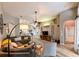 Open-concept living room with neutral paint, tile floors, and modern decor at 30623 Bittsbury Ct, Wesley Chapel, FL 33543