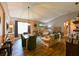 Open-concept living room with a dining area, fireplace, and comfortable seating, ideal for gatherings at 30623 Bittsbury Ct, Wesley Chapel, FL 33543