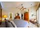 Spacious main bedroom with wood floors, a ceiling fan, and great natural light at 30623 Bittsbury Ct, Wesley Chapel, FL 33543