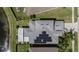 Aerial view of home with solar panels, a fenced yard, and a pond, showcasing its desirable location at 3219 Gianna Way, Land O Lakes, FL 34638