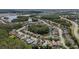 Aerial view of a community featuring beautiful homes and scenic waterways at 3219 Gianna Way, Land O Lakes, FL 34638