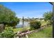 Enjoy tranquil lake views from your backyard oasis, complete with manicured landscaping at 3219 Gianna Way, Land O Lakes, FL 34638