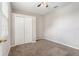 Carpeted bedroom with a double door closet and a window for natural light at 3219 Gianna Way, Land O Lakes, FL 34638