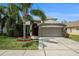 Charming single-Gathering home with manicured lawn and mature landscaping at 3219 Gianna Way, Land O Lakes, FL 34638