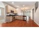 Bright kitchen features wood cabinets, stainless steel appliances, and a view into the living area at 3219 Gianna Way, Land O Lakes, FL 34638