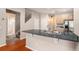 Kitchen with granite countertops, a stainless steel sink, hardwood floors, and ample storage at 3219 Gianna Way, Land O Lakes, FL 34638