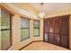 Breakfast nook featuring three windows providing plenty of natural light, and a closet for storage at 34796 Hibiscus St, Dade City, FL 33525