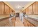 Galley kitchen featuring a window over the sink, granite countertops and plenty of cabinet space at 34796 Hibiscus St, Dade City, FL 33525