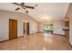 Spacious living room with tile flooring and a ceiling fan at 34796 Hibiscus St, Dade City, FL 33525