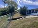 Fenced backyard featuring a set of concrete steps leading to a lower area, offering potential for landscaping at 3542 Delta Pl, Holiday, FL 34691