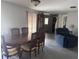Cozy dining area featuring a dining table, chairs, and view into an adjacent living space at 3542 Delta Pl, Holiday, FL 34691