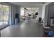 Open living area featuring tile flooring, comfortable furnishings, and access to the lanai, ideal for relaxing at 3542 Delta Pl, Holiday, FL 34691