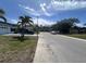 Quiet residential street showcasing well-maintained homes, including one with a black SUV parked out front at 3542 Delta Pl, Holiday, FL 34691