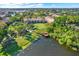 Aerial community view showcasing lush greenery, private lake access and residential charm at 4002 Crockers Lake Blvd # 1-128, Sarasota, FL 34238