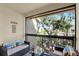 Relaxing balcony featuring cozy furniture and outdoor scenery at 4002 Crockers Lake Blvd # 1-128, Sarasota, FL 34238