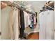 Well-organized walk-in closet with shelving and rods for clothing and storage at 4002 Crockers Lake Blvd # 1-128, Sarasota, FL 34238