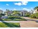 The community clubhouse is framed by a water fountain and lush landscaping, perfect for gatherings at 4002 Crockers Lake Blvd # 1-128, Sarasota, FL 34238