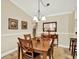 Cozy dining room with a wooden table set, neutral decor, and bright lighting at 4002 Crockers Lake Blvd # 1-128, Sarasota, FL 34238