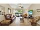 Bright living room with sliding glass doors leading to an outdoor balcony at 4002 Crockers Lake Blvd # 1-128, Sarasota, FL 34238